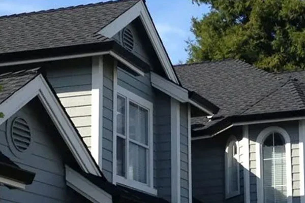 Shingle roof around dormer windows and intersecting roof planes
